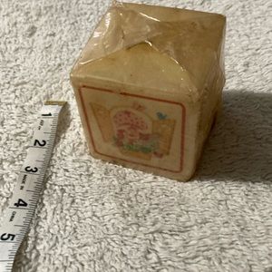 American greetings strawberry shortcake candle, two 7/8 x two 7/8 inches a